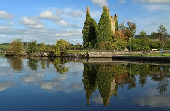 Castle ruins reflected in Lough Derg at Dromineer